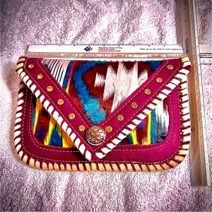 One of a kind hand made bag. Leather and cloth. Snap closure pocket with zipper.